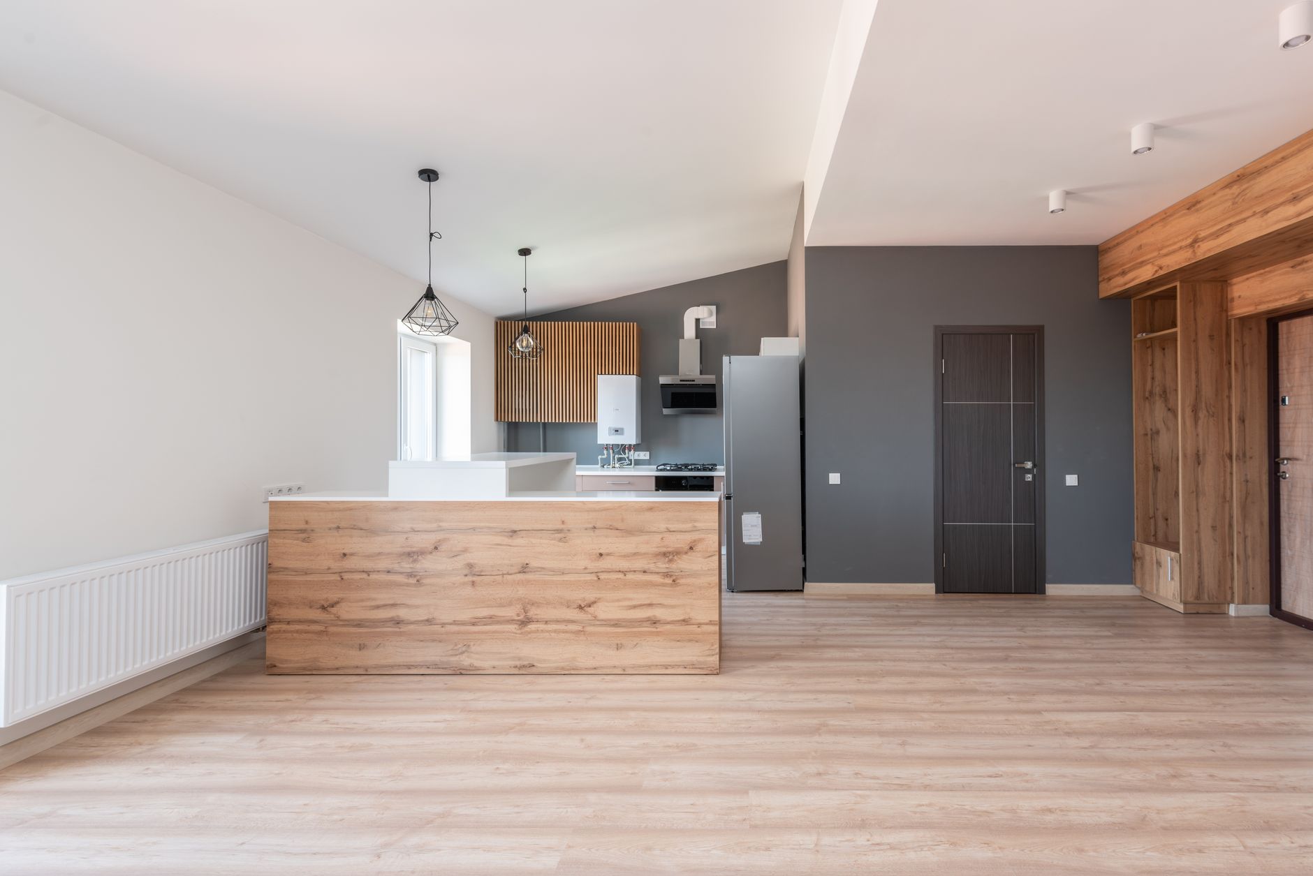 Open-plan kitchen with wide plank hardwood floor